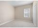 Inviting bedroom with neutral walls, carpet flooring, a window with blinds, and a closet for storage at 3835 Autumn Fern Ter, Sarasota, FL 34243