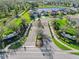 Magnolia Point community entrance featuring gated access, lush landscaping, and serene surroundings at 3835 Autumn Fern Ter, Sarasota, FL 34243