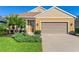Charming single-story home boasts a well-manicured lawn and a two-car garage at 3835 Autumn Fern Ter, Sarasota, FL 34243