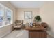 Home office featuring a modern desk, comfortable seating, and a large window for plenty of natural light at 3835 Autumn Fern Ter, Sarasota, FL 34243