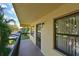 Cozy balcony with exterior unit number, railing and views of trees and parking at 425 30Th W Ave # C201, Bradenton, FL 34205