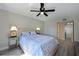 Cozy bedroom features calming colors, a ceiling fan and lots of natural light at 425 30Th W Ave # C201, Bradenton, FL 34205