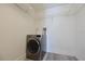Convenient laundry room with modern washing machine and ample shelving for storage at 425 30Th W Ave # C201, Bradenton, FL 34205