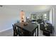 View from dining area into living room with comfortable seating and open floor plan in a modern design at 425 30Th W Ave # C201, Bradenton, FL 34205