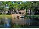 Picturesque pond view showcasing a charming gazebo and lush green surroundings at 425 30Th W Ave # C201, Bradenton, FL 34205