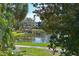 Picturesque view of the community pond featuring a gazebo, lush landscaping, and relaxing scenery at 425 30Th W Ave # C201, Bradenton, FL 34205