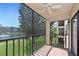 The screened balcony offers panoramic views of the community's lush landscaping and serene pond at 425 30Th W Ave # C201, Bradenton, FL 34205