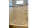 Close-up view of a bathtub with a tiled shower at 4802 51St W St # 1420, Bradenton, FL 34210