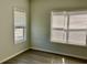 Bedroom featuring two windows, neutral walls, and modern flooring at 4802 51St W St # 1420, Bradenton, FL 34210