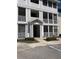 Condo building entrance featuring a staircase, screened porches, and easy accessibility for residents and visitors at 4802 51St W St # 1420, Bradenton, FL 34210