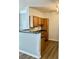 Modern kitchen featuring granite countertops, wooden cabinetry, and a convenient breakfast bar for casual dining at 4802 51St W St # 1420, Bradenton, FL 34210