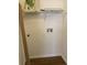 A functional laundry room space with washer and dryer hookups and practical overhead shelving at 4802 51St W St # 1420, Bradenton, FL 34210