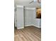 Open living room featuring hardwood floors, neutral paint, modern lighting, and an open layout at 4802 51St W St # 1420, Bradenton, FL 34210