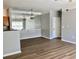The living room features hardwood flooring, neutral paint, modern lighting, and an open view of the kitchen at 4802 51St W St # 1420, Bradenton, FL 34210
