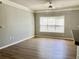 The living room has wood floors, large window, and neutral paint, creating a bright and inviting atmosphere at 4802 51St W St # 1420, Bradenton, FL 34210