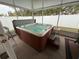 Relaxing enclosed hot tub with adjacent seating and privacy screens at 509 Stone Briar Dr, Ruskin, FL 33570