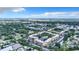 Aerial view showcasing the community's lush landscaping, pool, and well-maintained buildings at 515 30Th Ave W # H410, Bradenton, FL 34205