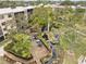 Aerial view of the property's landscaped grounds, including seating area and winding stream at 515 30Th Ave W # H410, Bradenton, FL 34205