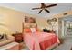 Comfortable bedroom featuring a cozy armchair, desk, and ample closet space at 515 30Th Ave W # H410, Bradenton, FL 34205