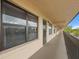 Exterior view of condo building hallway, showing the entry doors to individual units at 515 30Th Ave W # H410, Bradenton, FL 34205