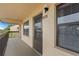 Exterior view of condo entry, showing the front door and windows of individual units at 515 30Th Ave W # H410, Bradenton, FL 34205