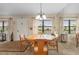 Bright dining area featuring a table with seating for six and natural light from the windows at 515 30Th Ave W # H410, Bradenton, FL 34205