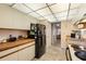 Kitchen featuring wood cabinets, and neutral countertops at 515 30Th Ave W # H410, Bradenton, FL 34205