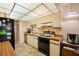 Cozy kitchen featuring light wood cabinets and laminate countertops at 515 30Th Ave W # H410, Bradenton, FL 34205