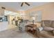 Relaxing living room with two recliners and a view into the adjacent kitchen at 515 30Th Ave W # H410, Bradenton, FL 34205