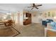 Cozy living room, showcasing comfortable seating, carpeted floors, and natural light at 515 30Th Ave W # H410, Bradenton, FL 34205