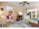 Cozy living room leading to bedroom and kitchen featuring a tv and carpet floors at 515 30Th Ave W # H410, Bradenton, FL 34205