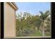 Window view of lush landscape and manicured garden at 515 30Th Ave W # H410, Bradenton, FL 34205