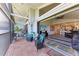 Inviting balcony with tiled floor, patio furniture, and seamless access to the indoors at 515 Leffingwell Ave # 210, Ellenton, FL 34222