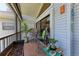Cozy balcony with comfortable seating and a picturesque view of trees and outdoors at 515 Leffingwell Ave # 210, Ellenton, FL 34222