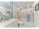 Modern bathroom featuring a walk-in shower and blue-tiled accent wall at 515 Leffingwell Ave # 210, Ellenton, FL 34222