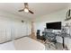 Bedroom features a ceiling fan, closet, and workspace at 515 Leffingwell Ave # 210, Ellenton, FL 34222