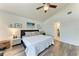 Bedroom featuring a comfortable bed, side tables, and light from the ceiling fan at 515 Leffingwell Ave # 210, Ellenton, FL 34222