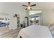Bedroom with lots of natural light, desk and storage space, and sliding glass doors to the balcony at 515 Leffingwell Ave # 210, Ellenton, FL 34222