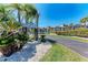 Community sign at River Place leads to waterfront condos and tropical landscaping at 515 Leffingwell Ave # 210, Ellenton, FL 34222