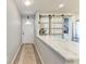 Bright entryway with a marble counter, barn doors, and access to the kitchen at 515 Leffingwell Ave # 210, Ellenton, FL 34222