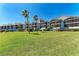 Waterfront townhouses feature screened balconies and well-maintained lawn, providing relaxing views and ample outdoor space at 515 Leffingwell Ave # 210, Ellenton, FL 34222