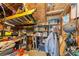 Organized garage with ladder, storage shelves, tools and assorted supplies, providing ample space for projects and storage at 515 Leffingwell Ave # 210, Ellenton, FL 34222