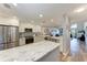 Bright kitchen with stainless steel appliances and a view of the living area at 515 Leffingwell Ave # 210, Ellenton, FL 34222