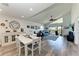 Bright, open-concept living and dining area with vaulted ceilings and balcony access at 515 Leffingwell Ave # 210, Ellenton, FL 34222