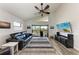Bright living room with modern decor, a balcony, and a view of the water at 515 Leffingwell Ave # 210, Ellenton, FL 34222