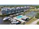 Waterfront townhouses with a pool and boat docks, surrounded by lush landscaping, offer resort-style living at 515 Leffingwell Ave # 210, Ellenton, FL 34222
