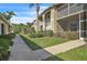 Attractive condo buildings with landscaped walkways, offering a tranquil and well-maintained community at 5211 Mahogany Run Ave # 126, Sarasota, FL 34241