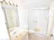 Bathroom featuring a stand-up shower with glass doors, a toilet, and a vanity sink at 5684 Sheffield Greene Cir # 79, Sarasota, FL 34235
