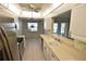 Functional kitchen featuring a breakfast bar, stainless steel appliances, and tiled floors at 5684 Sheffield Greene Cir # 79, Sarasota, FL 34235