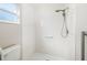 This bright bathroom offers a walk-in shower, grab bars, and white subway tile at 5814 Garden Lakes Fern, Bradenton, FL 34203